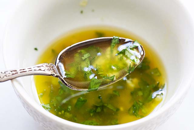 Grilled salmon marinade in a white bowl.