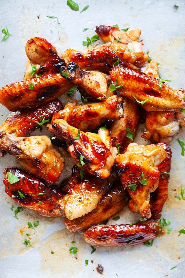 Baked chicken wings on baking sheet, after baking in the oven at 400 degrees Fahrenheit for 30 minutes.