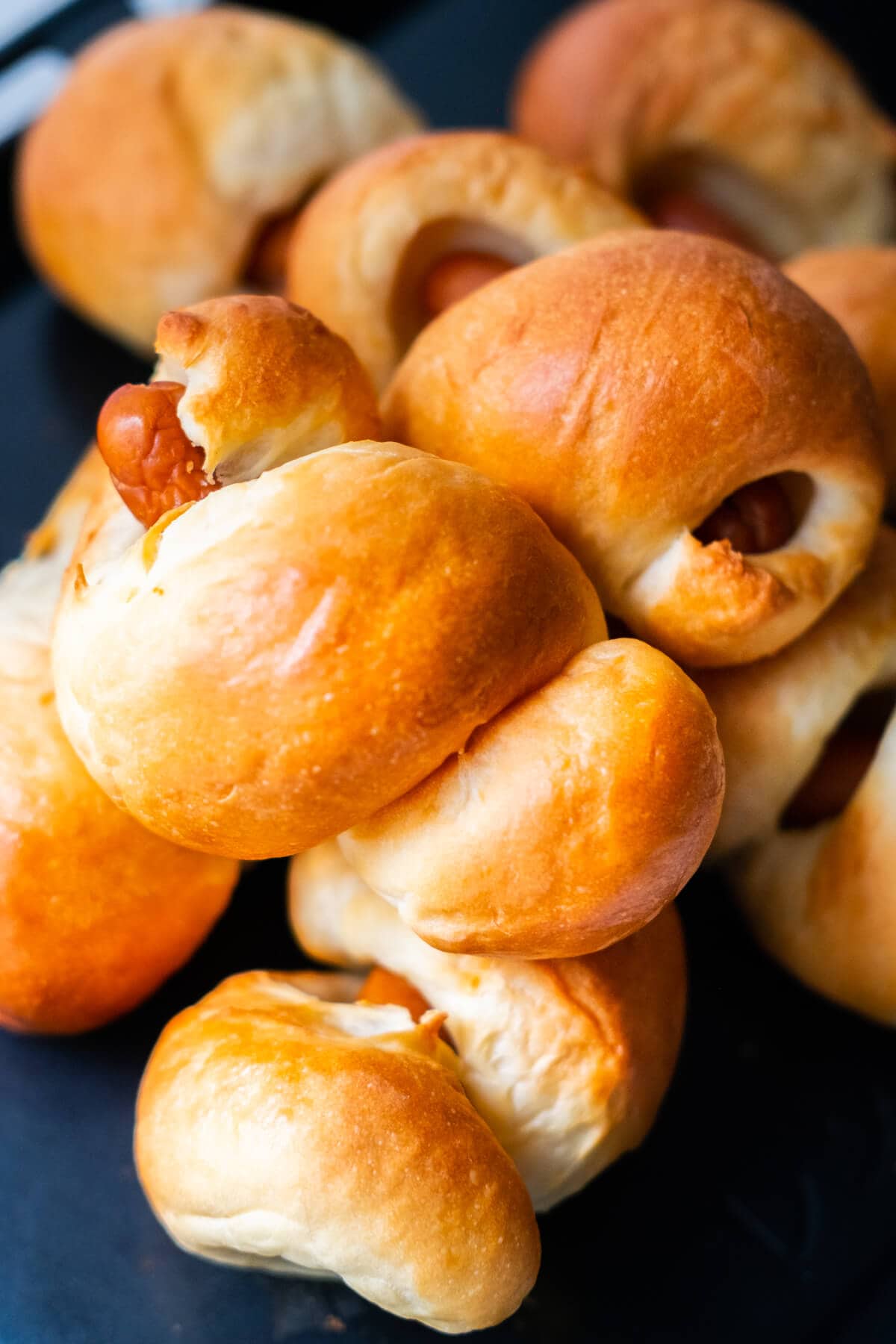 Sausage rolls served on a platter. 