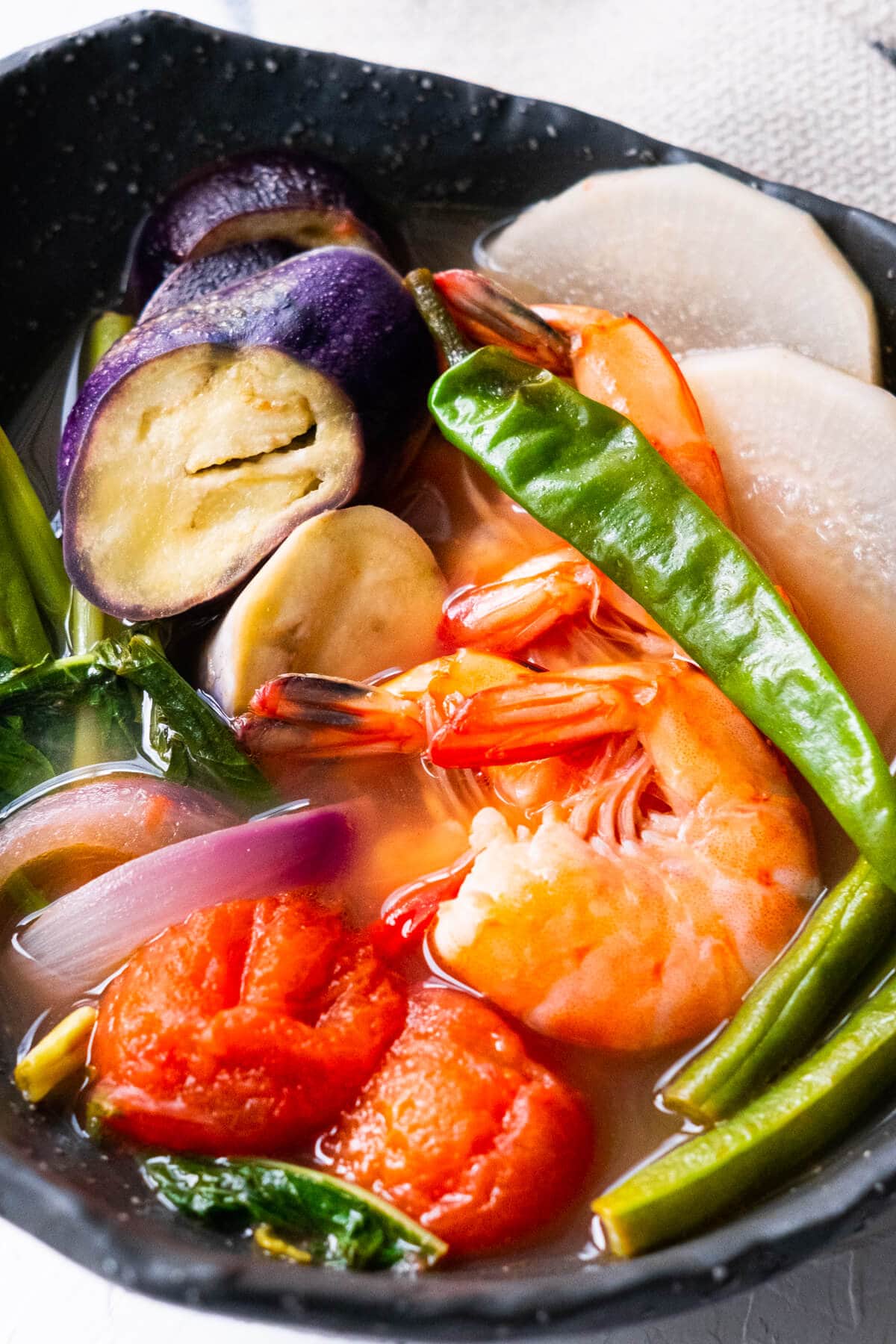 Close up of sinigang recipe made with shrimp in this yummy and easy Filipino stew.