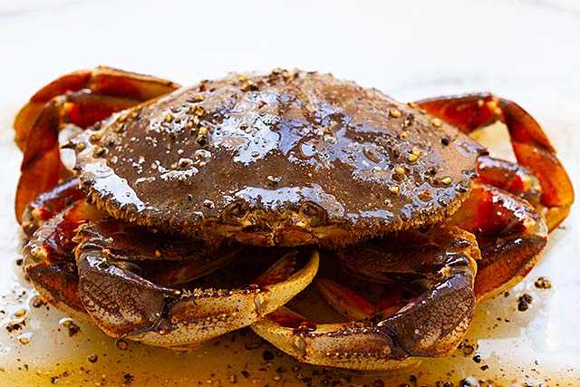 Coat the crab with black pepper butter.