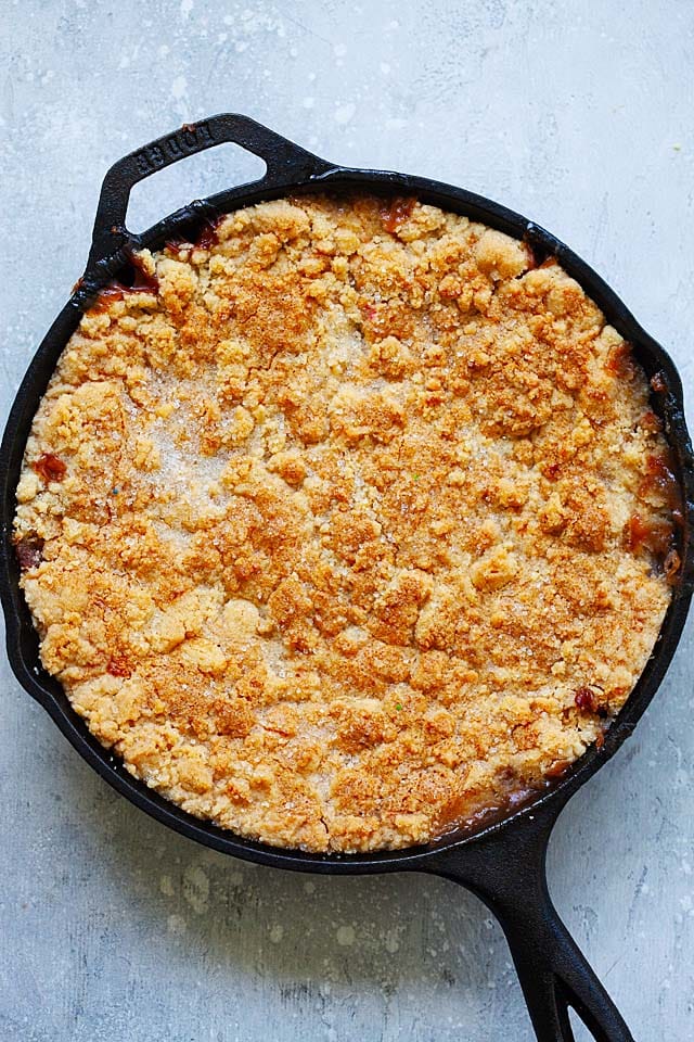 Peach cobbler in a cast-iron skillet.