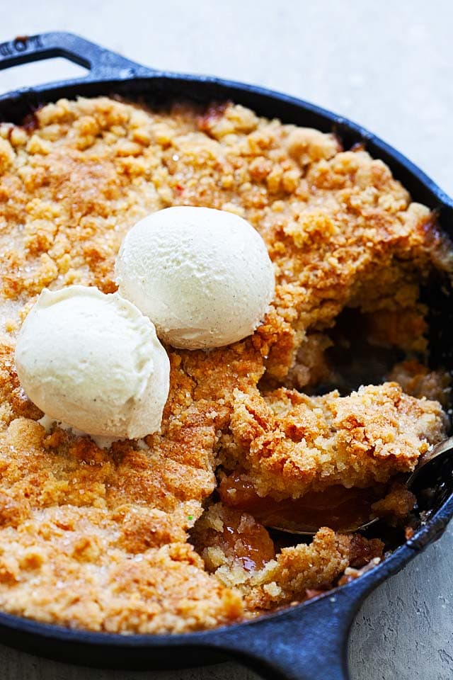 Peach cobbler pie baked in a cast-iron skillet.