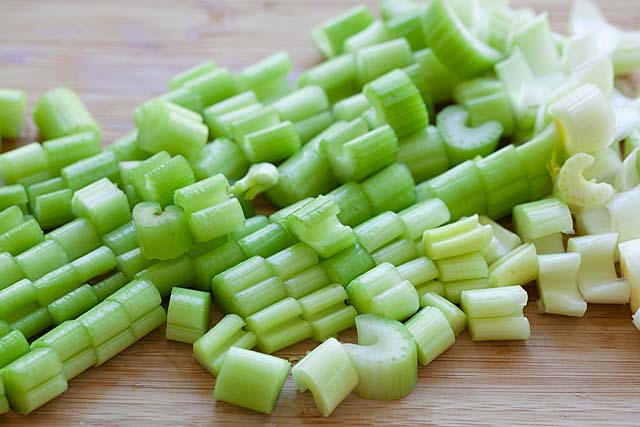 Celery pieces on a chopping board. 