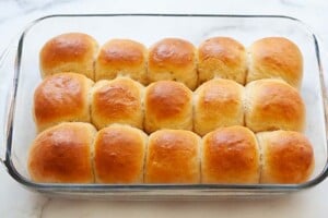 Baked Hawaiian Rolls in a baking pan.