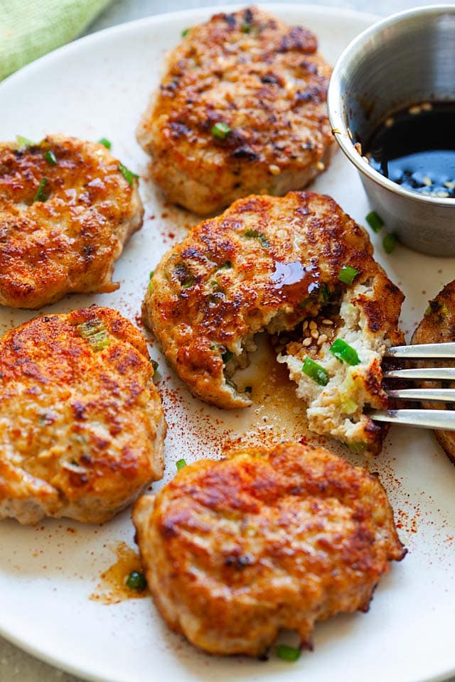 Homemade chicken patties on a plate.