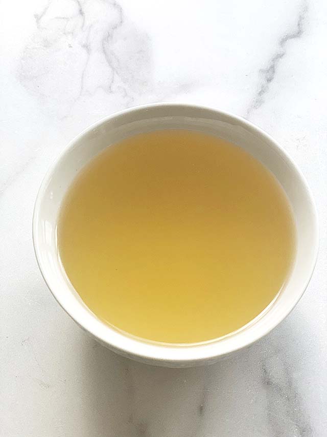 A bowl of clear dashi broth or dashi stock made with an easy dashi recipe of only 3 ingredients. 