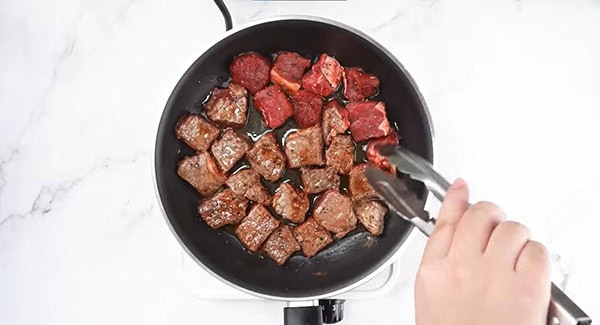 Cook the marinated steak bites.