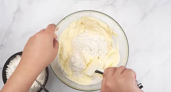 Mix in the flour mixture with the butter mixture.