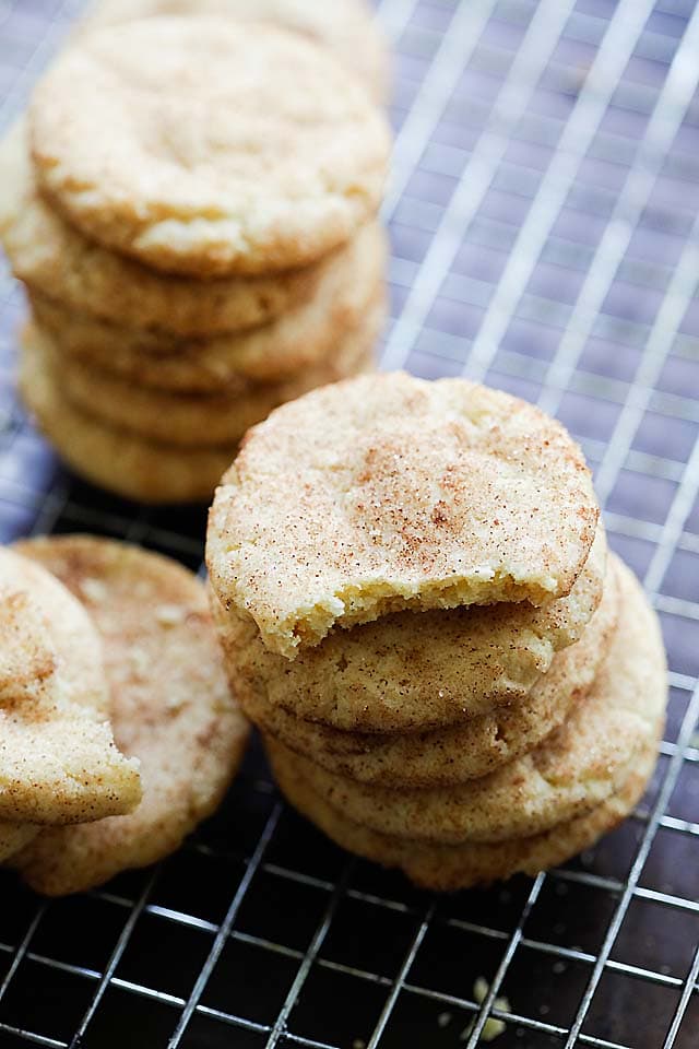 Snickerdoodle cookies cooling on a wire rack.