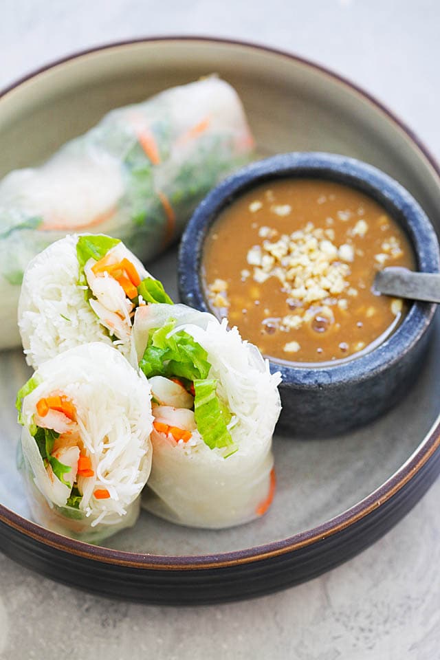 Shrimp summer rolls served with a side of hoisin-peanut dressing sauce.