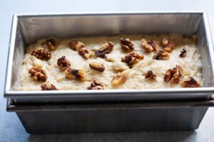 Banana nut bread batter in a loaf pan.