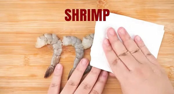 Pat the shrimp dry with paper towels.