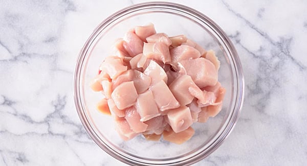 Small pieces of chicken meat on a bowl.