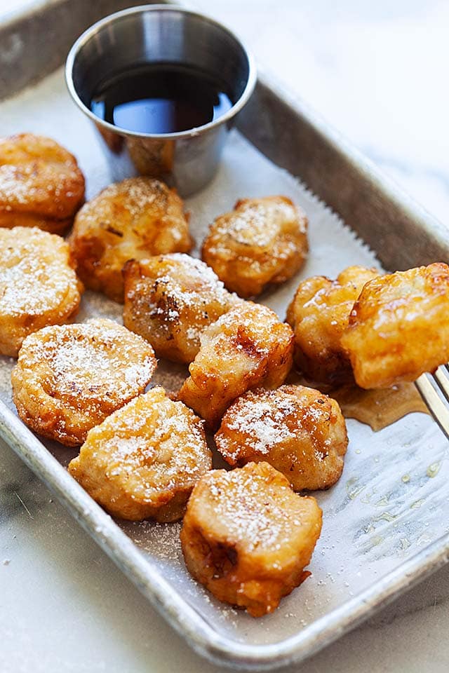 Caramelized fried bananas with a fork.