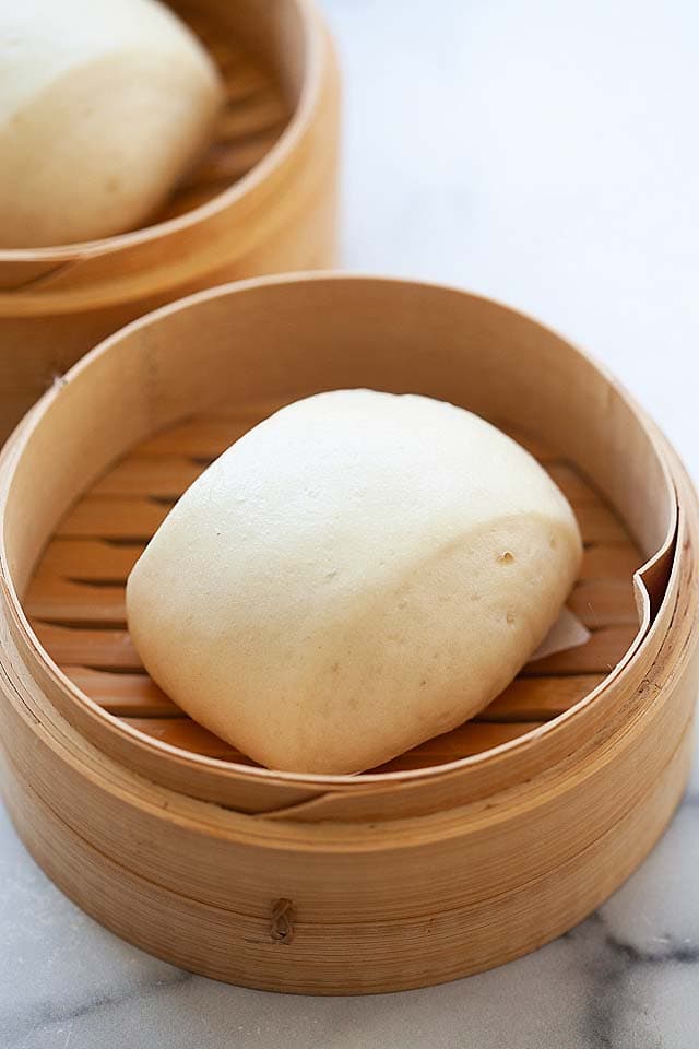 Steamed buns in a bamboo steamer.