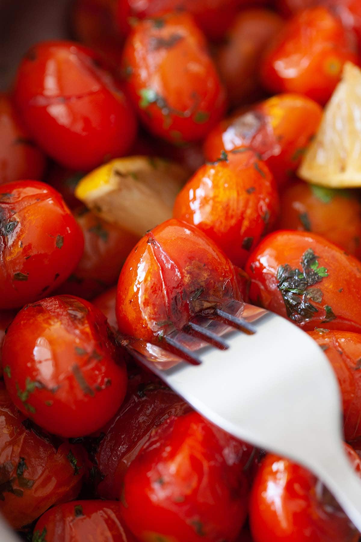 Grilled tomatoes in a skillet.