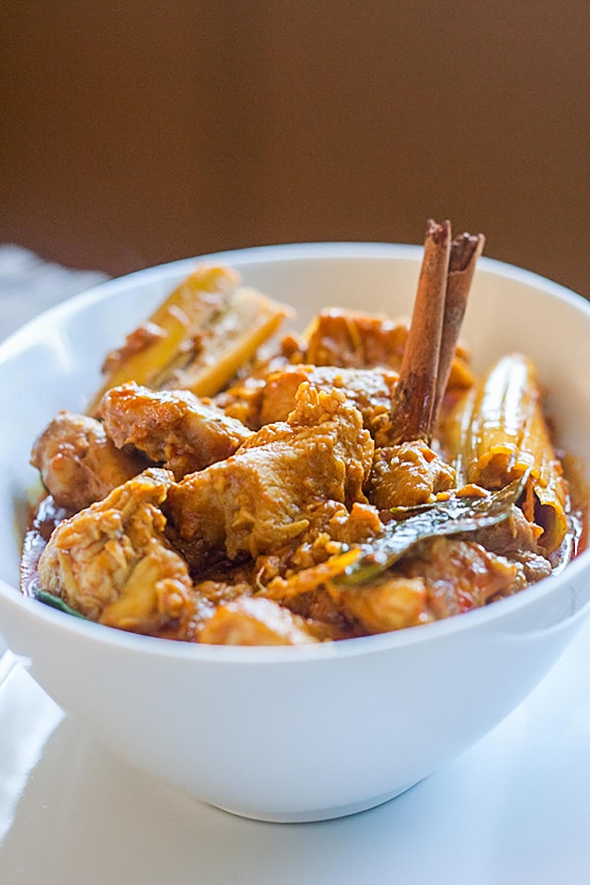 Easy chicken curry with chicken, spices and coconut milk with spicy curry sauce in a bowl.