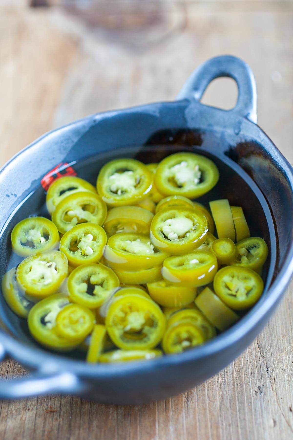 Pickled green chili is a popular condiment that accompanies many Southeast Asian street food and Asian noodle dishes. Have these for your guest for your Chinese New Years feast. | www.666630.xyz