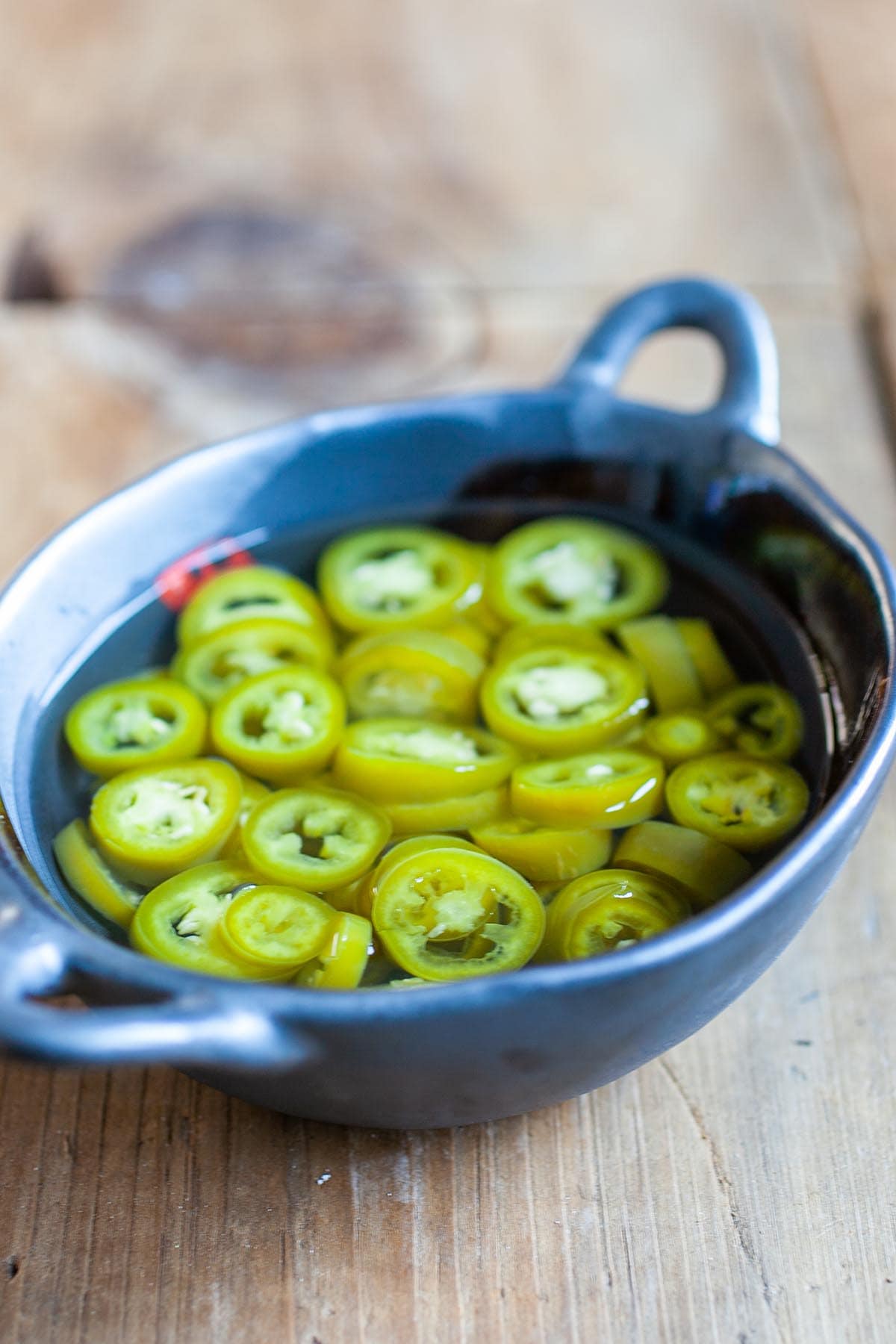 Pickled green chili is a popular condiment that accompanies many Southeast Asian street food and Asian noodle dishes. Have these for your guest for your Chinese New Years feast. | www.666630.xyz