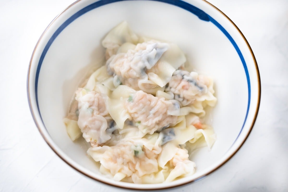 Cooked pork dumplings in a bowl. 