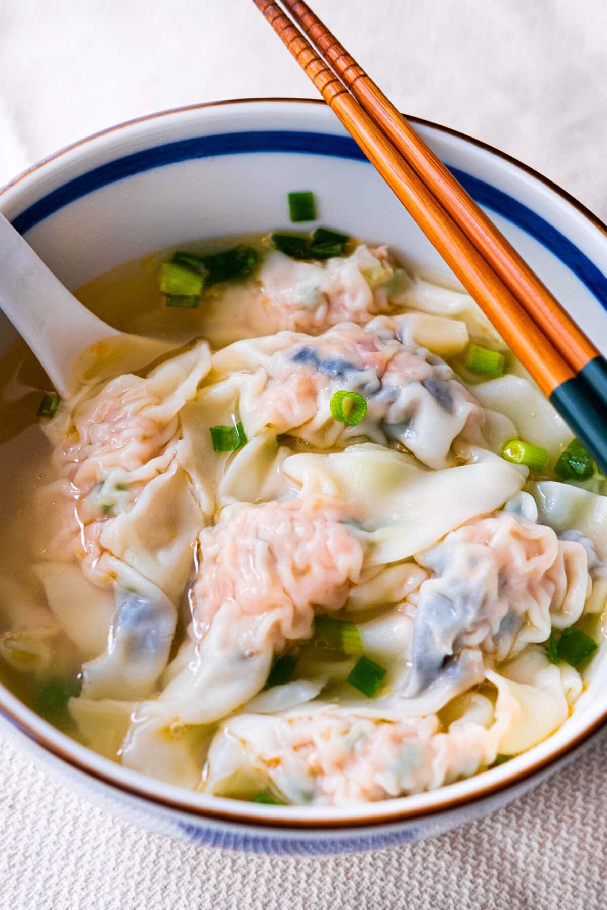 Easy pork dumplings soup recipe served in a bowl.