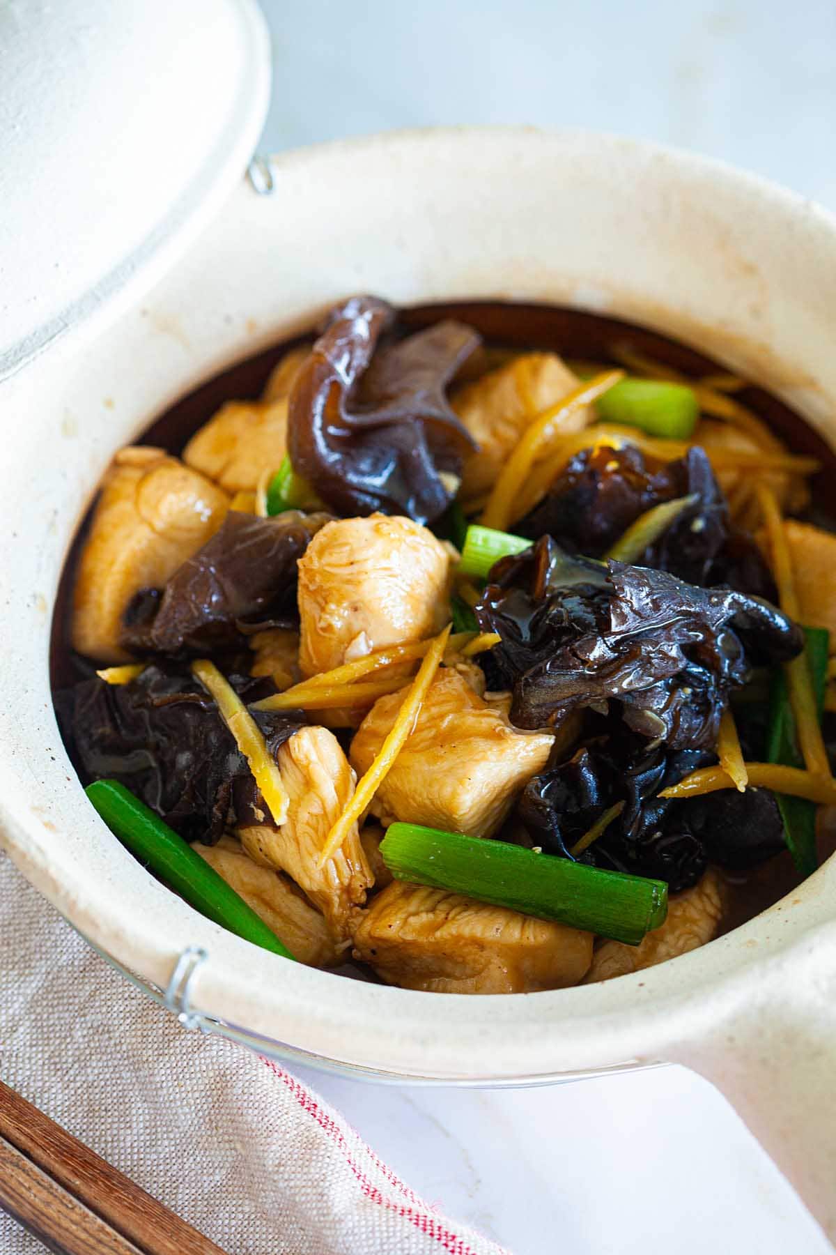 Brown stew chicken in a pot.