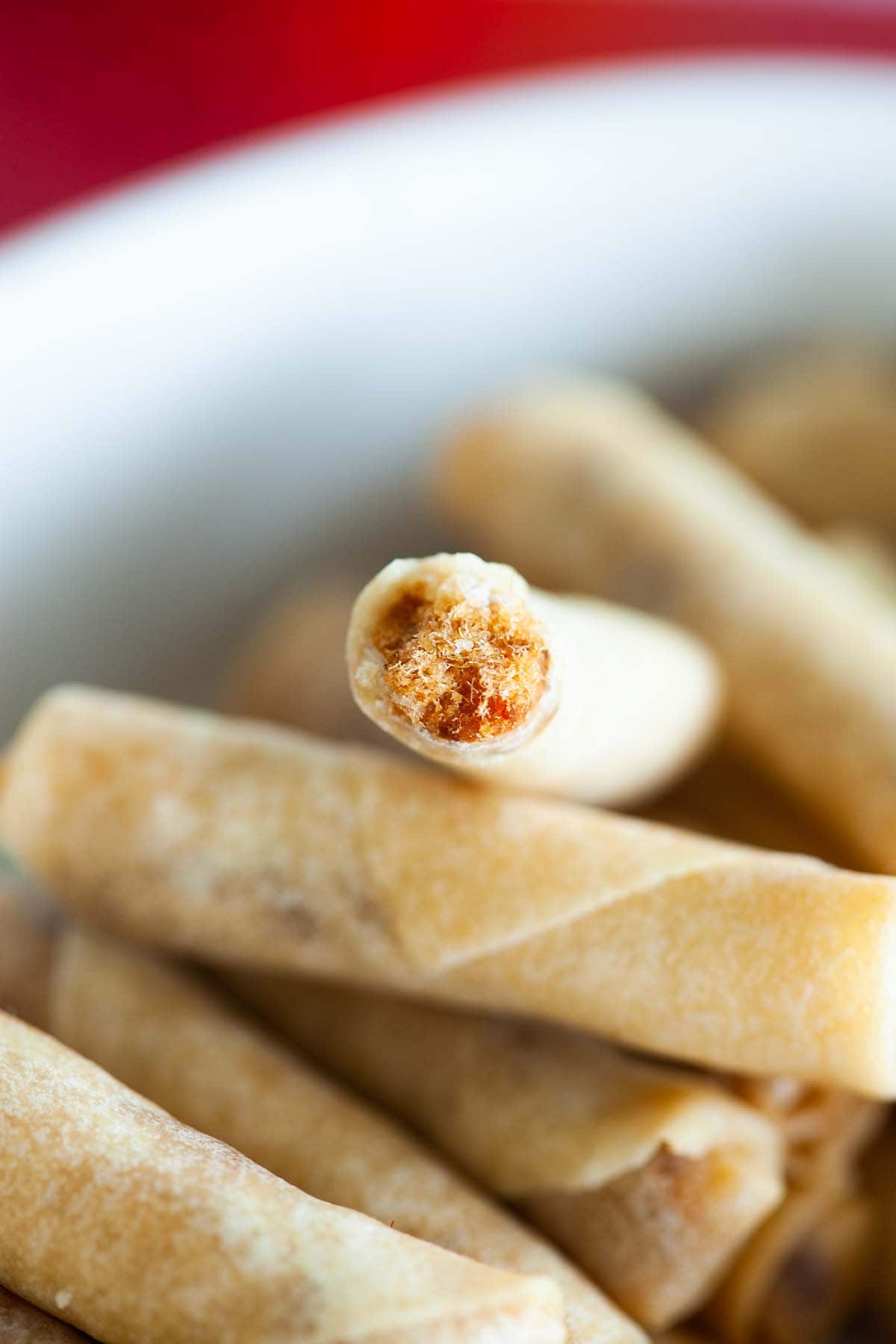 Chinese lunar new year crispy chicken floss spring rolls snacks served on a plate.