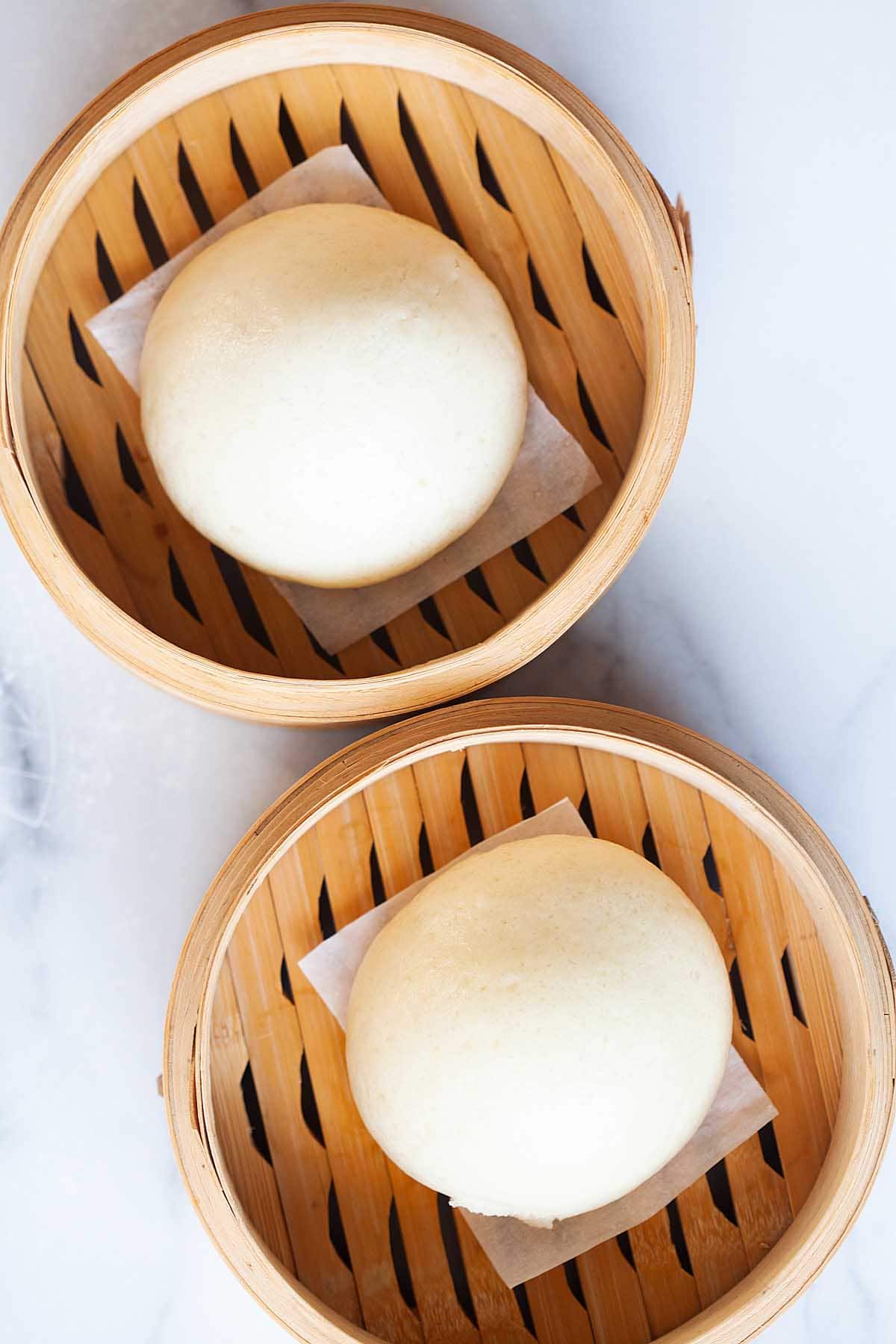 Taro buns in a steamer.