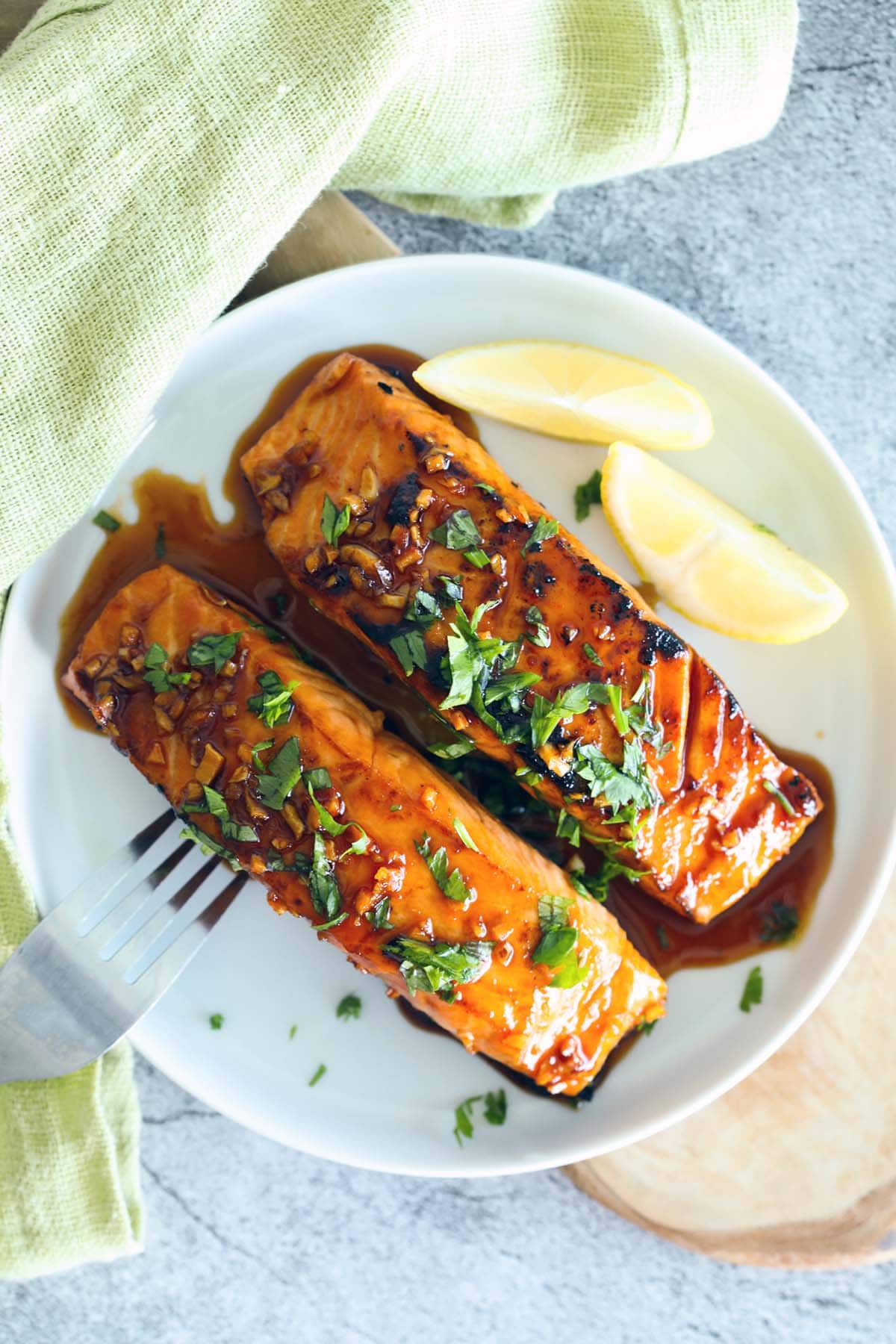 Honey sriracha salmon served on a plate.