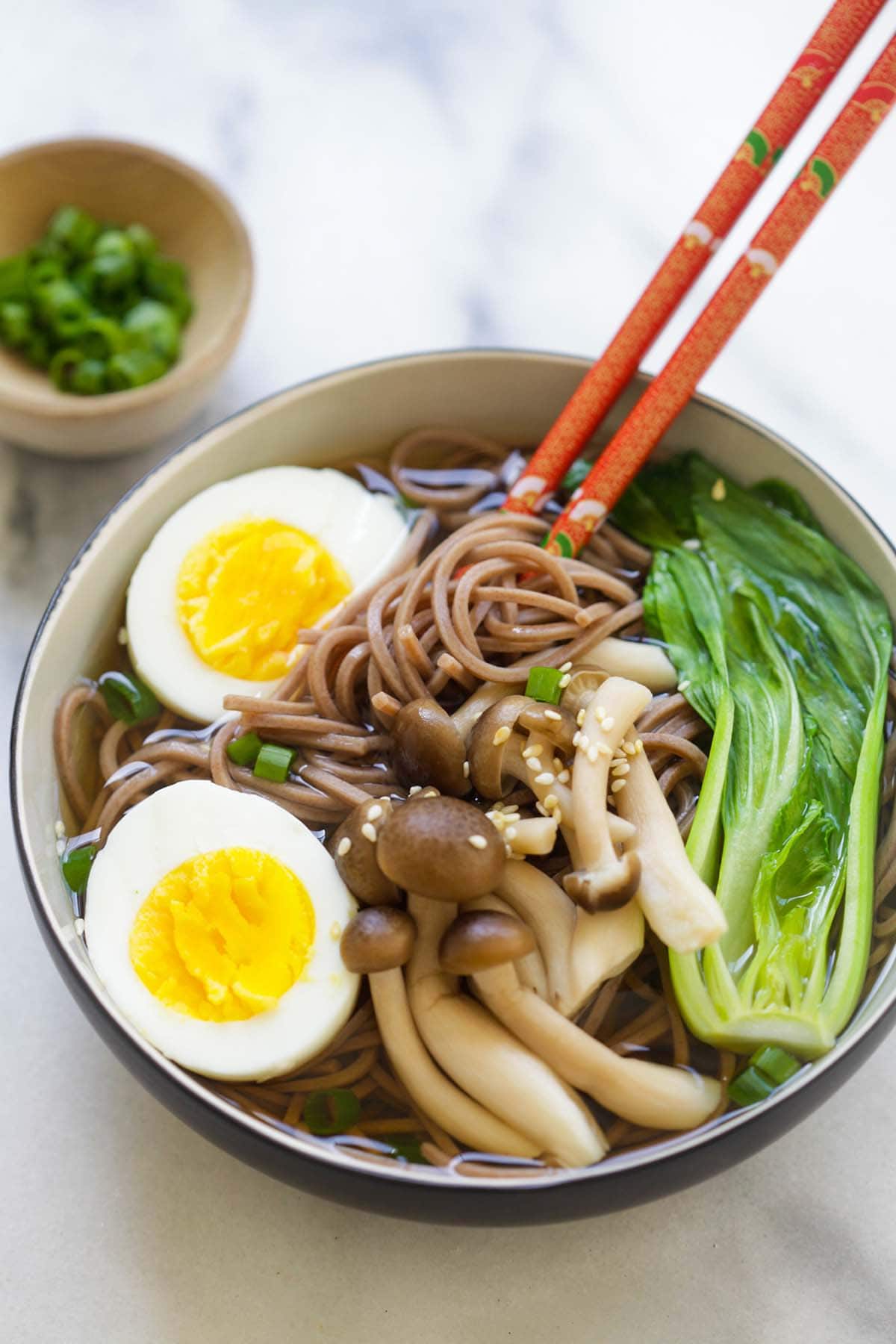 Soba noodle picked with a pair of chopsticks.