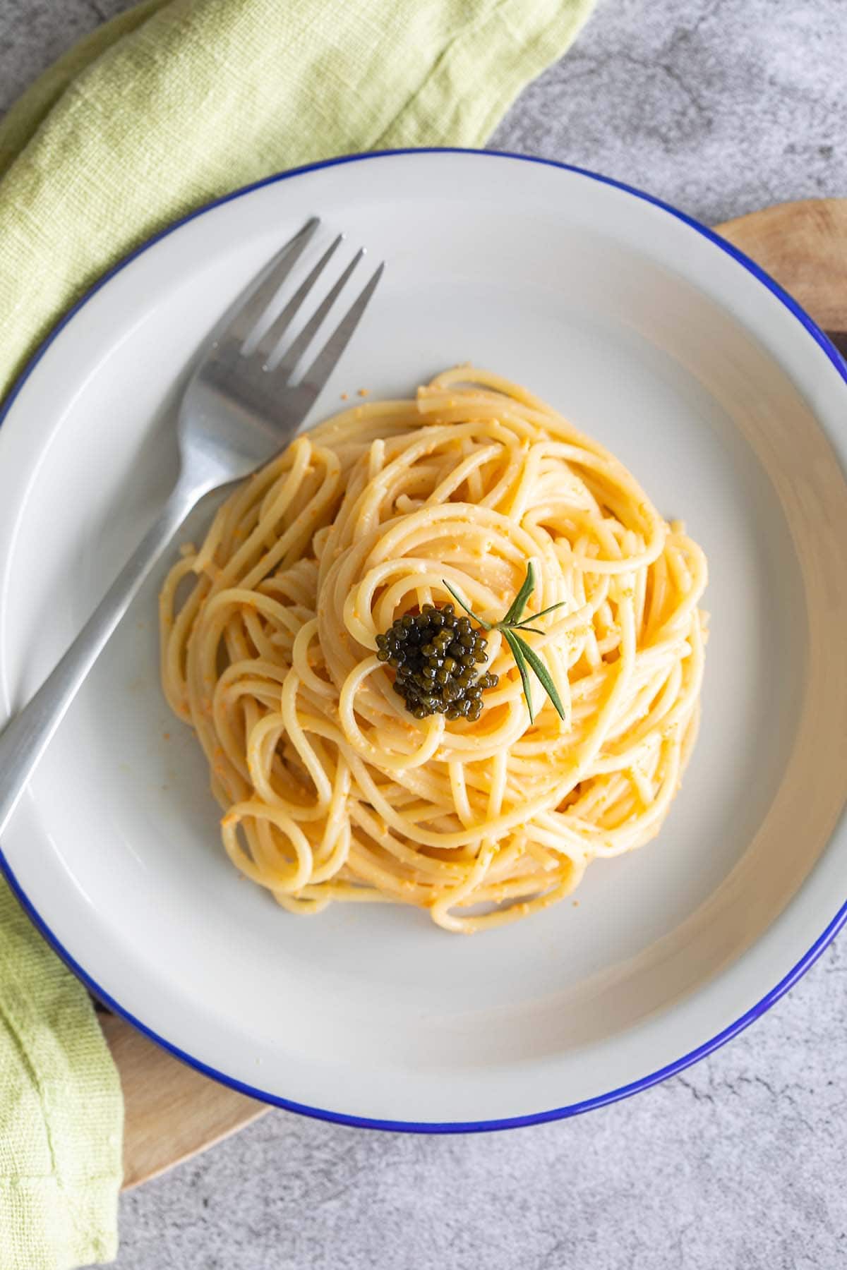 A top down shot of sea urchin pasta served on a plate.