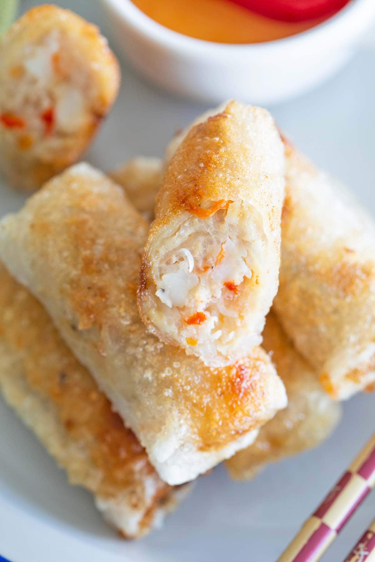 Vietnamese spring rolls, captured in an enticing display, showcasing the freshness and vibrant colors of the ingredients in this delightful dish.