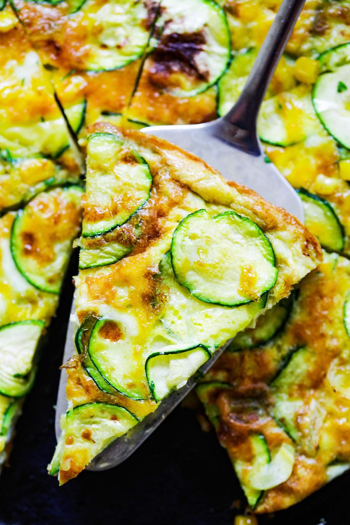 A piece of healthy homemade Italian zucchini frittata close up.