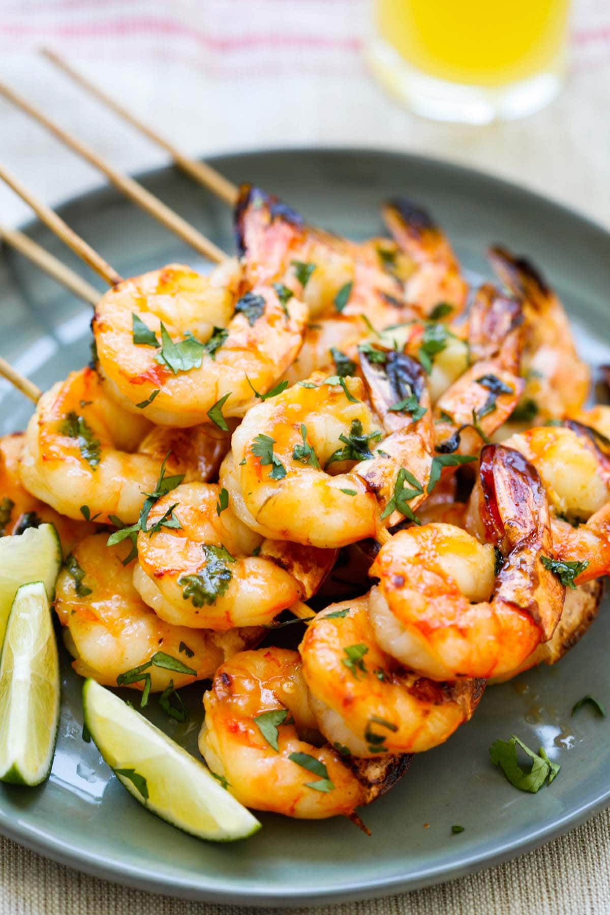 Honey Sriracha Shrimp Kebab with honey Sriracha butter in a plate.