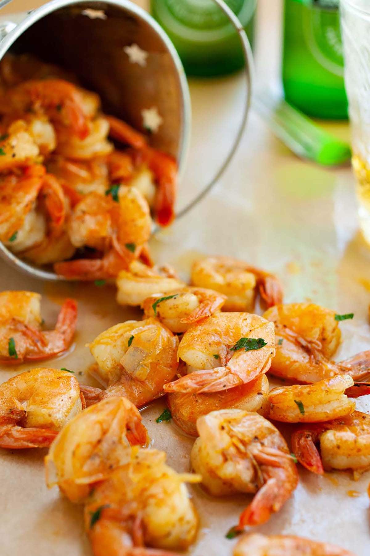 Easy and quick peel and eat shrimps sauteed with butter, beer and spices.