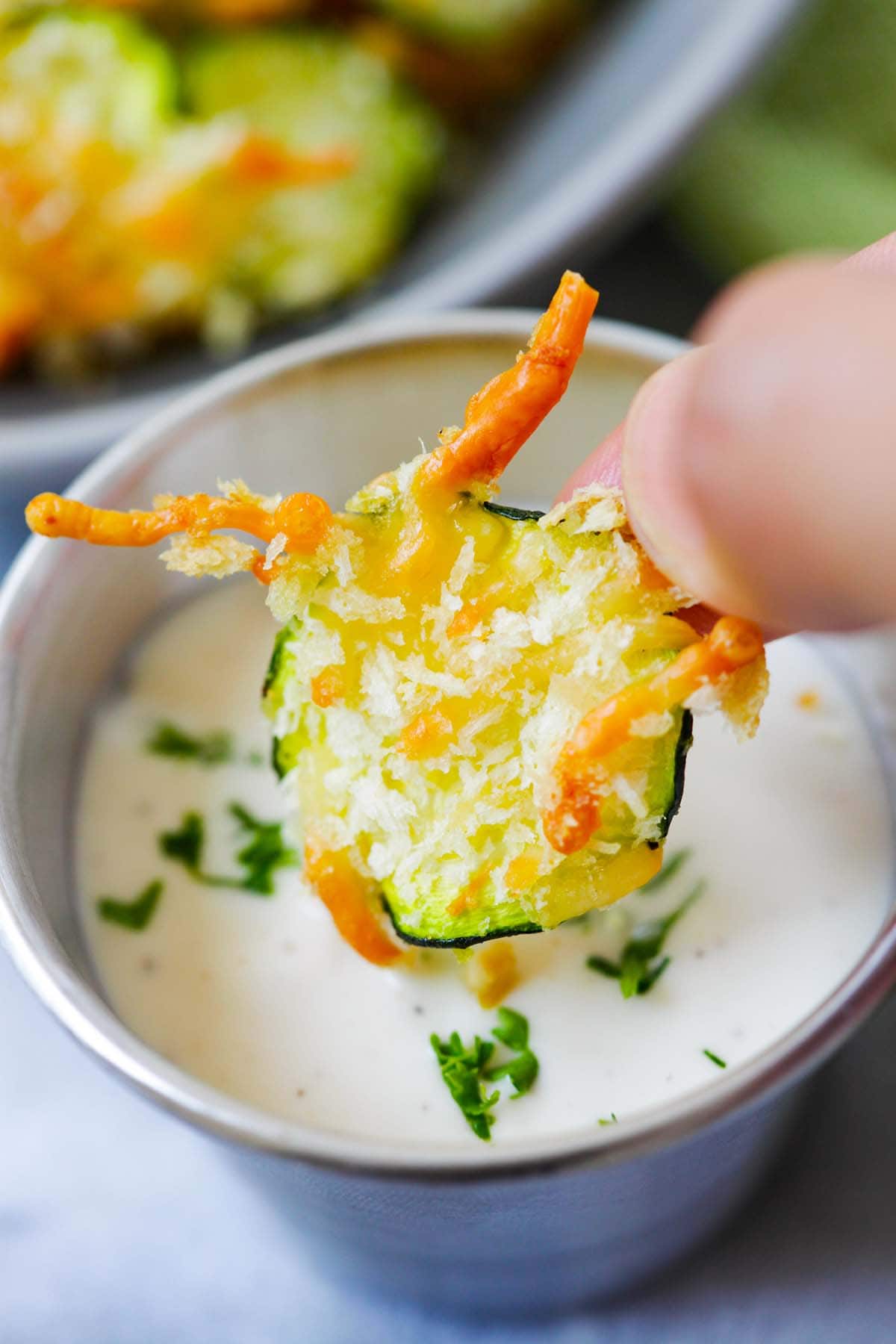 Zucchini chips with Parmesan cheese ready to be dip into sauce.