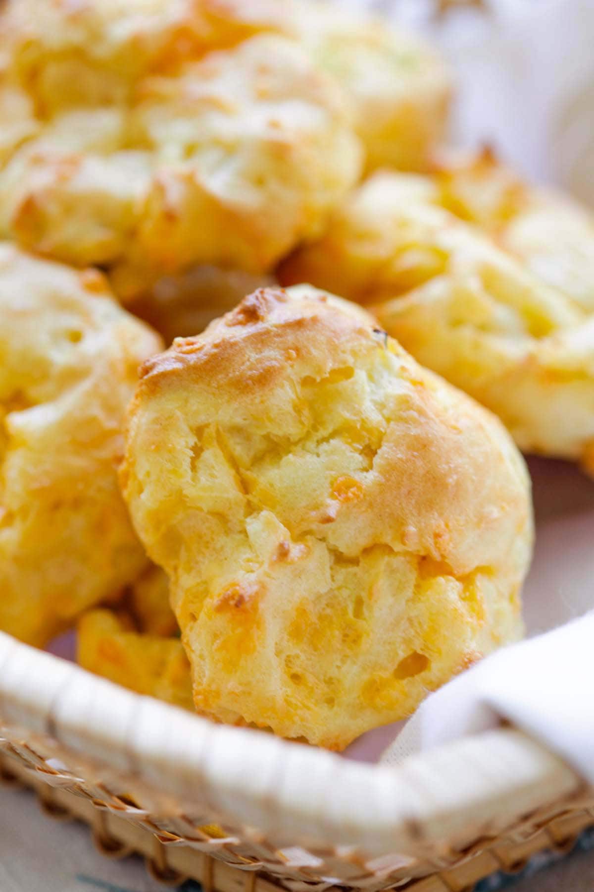 Close up shot of French choux pastry loaded with cheddar cheese.