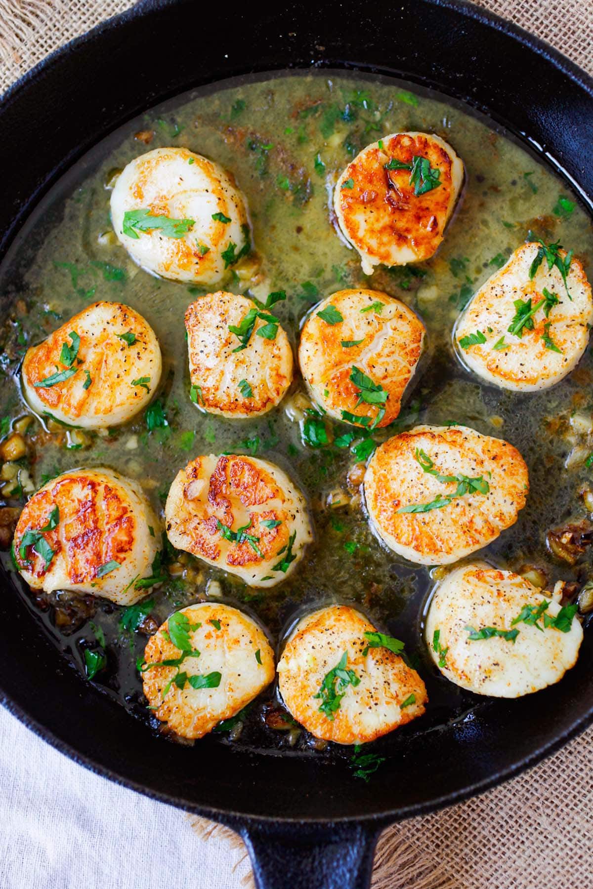 Sauteed scallops with garlic, butter, white wine and parsley.