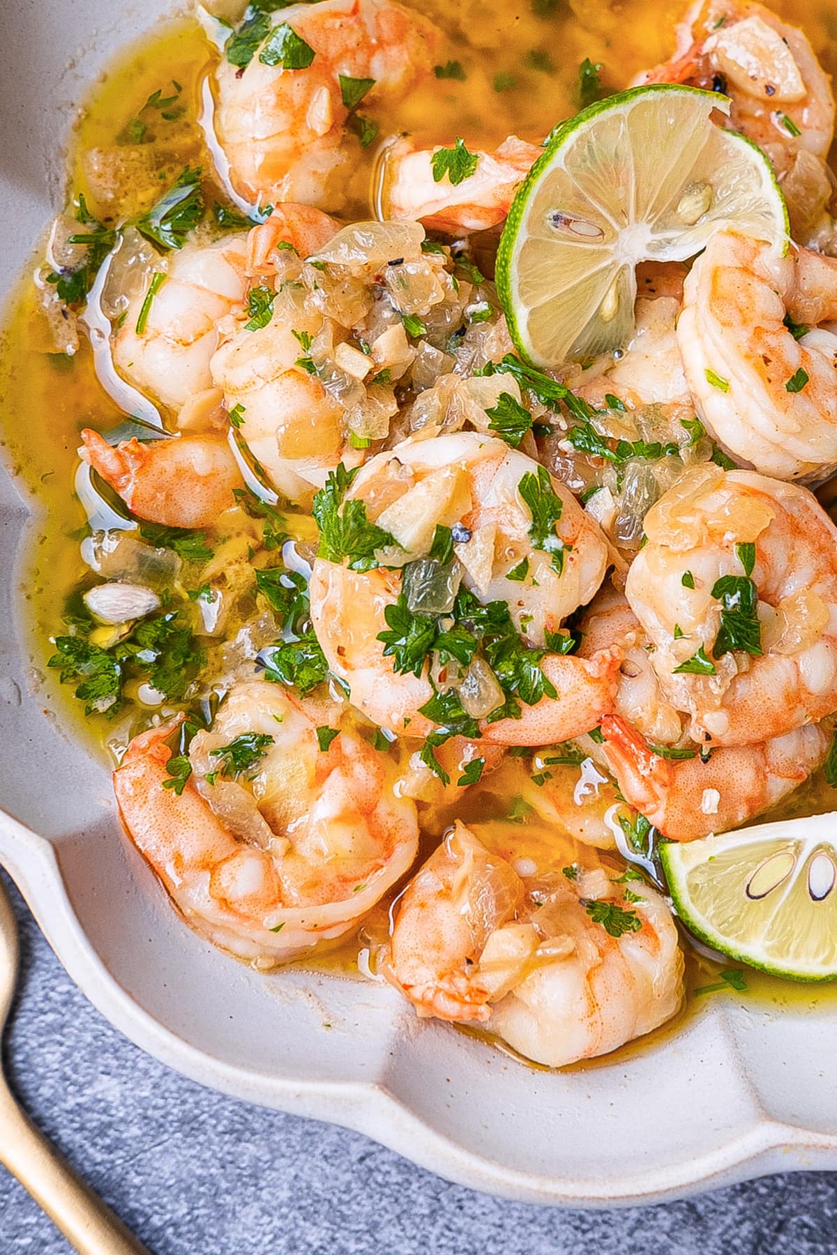 A mouthwatering plate of garlic white wine shrimp, featuring plump and succulent shrimp cooked in a flavorful blend of garlic and white wine. 