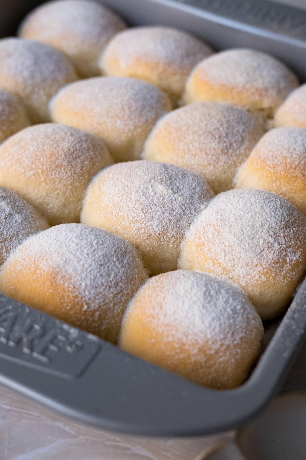 Cotton-soft milk bun in a baking tray.