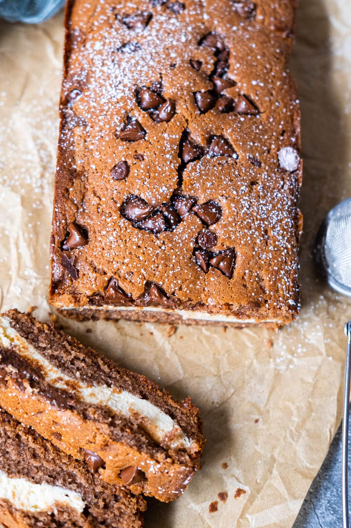 A mouthwatering image of a cream cheese chocolate cake with a luscious layer of cream cheese frosting on top.