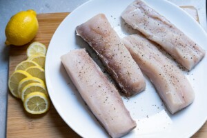 Sliced lemon, pat dry mahi-mahi fillet