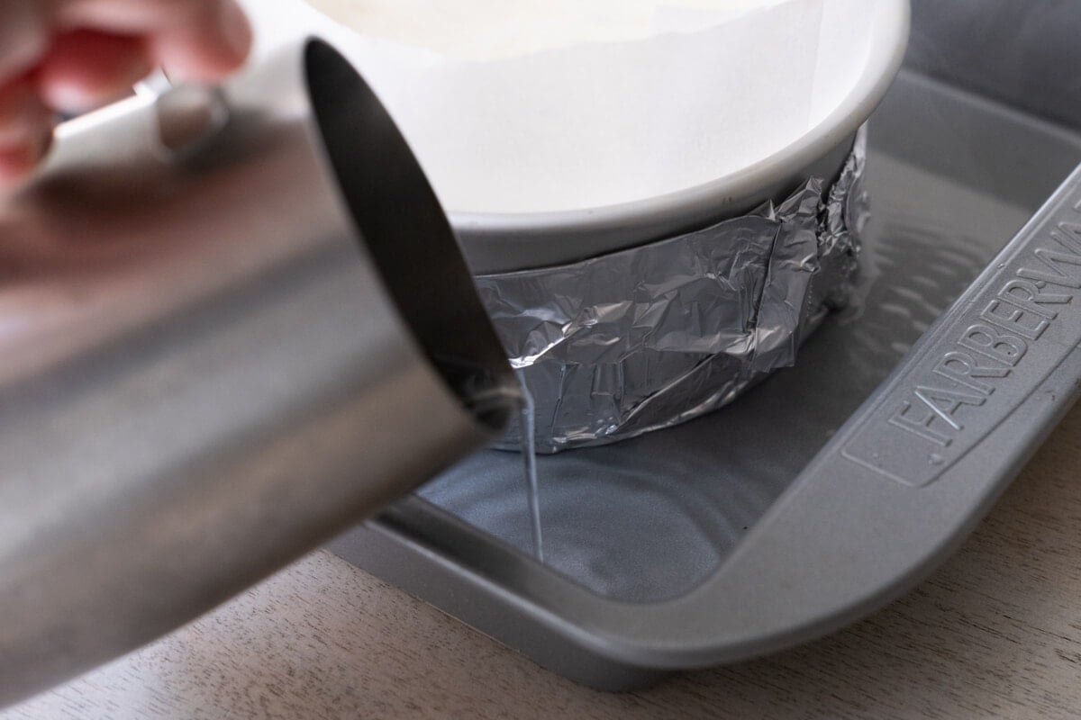 Boiling water added into a larger pan with the 6-inches cake pan placed in a larger pan.