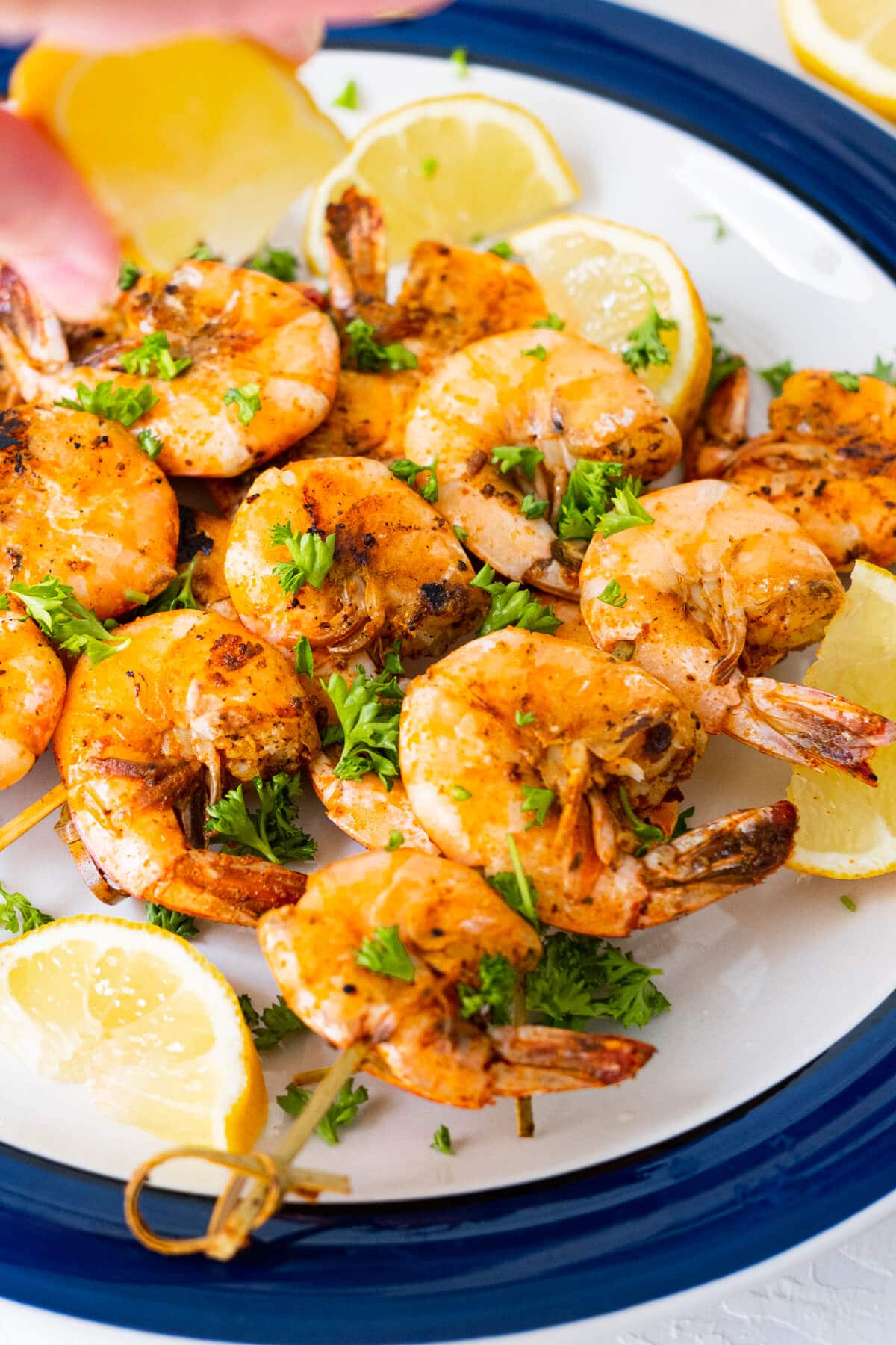 Fresh lemon juice squeezed on top of shrimps. 