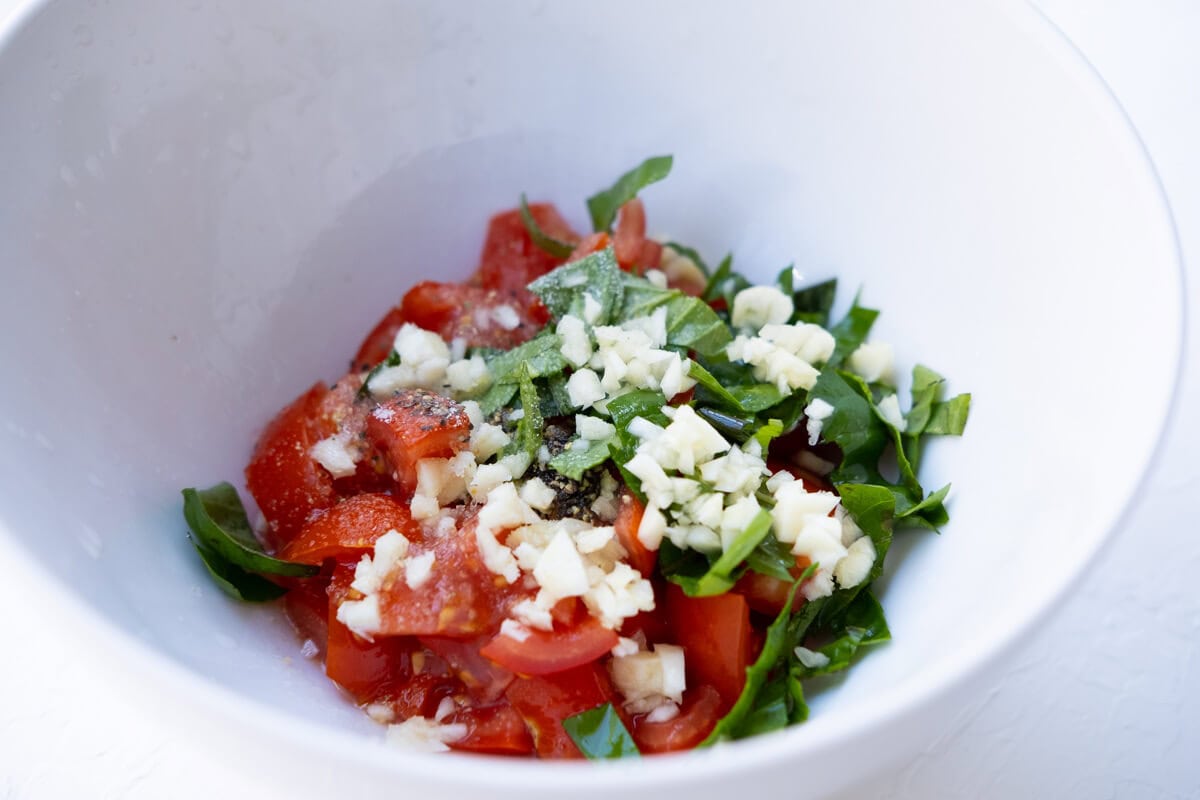 Tomato mixture mixed well in a bowl.