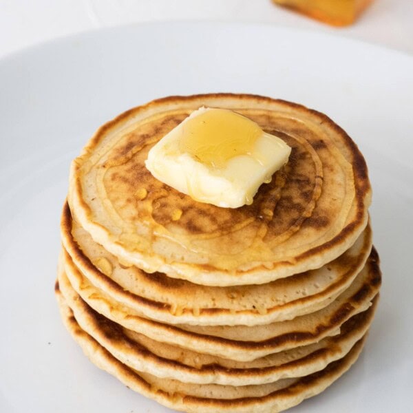 Queen Elizabeth II's drop scones served with butter and syrup dripping down.