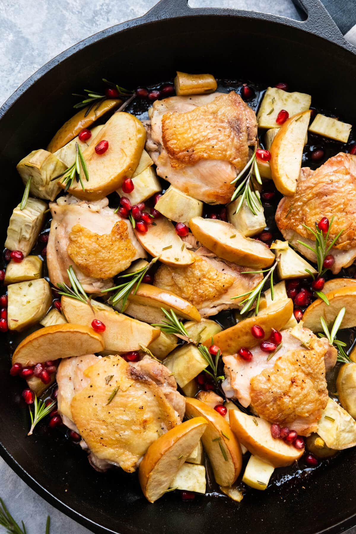 Apple cider glazed chicken with pomegranate sprinkled on top. 