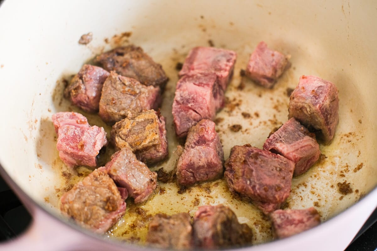 Cubed cut roast beef in the pot. 