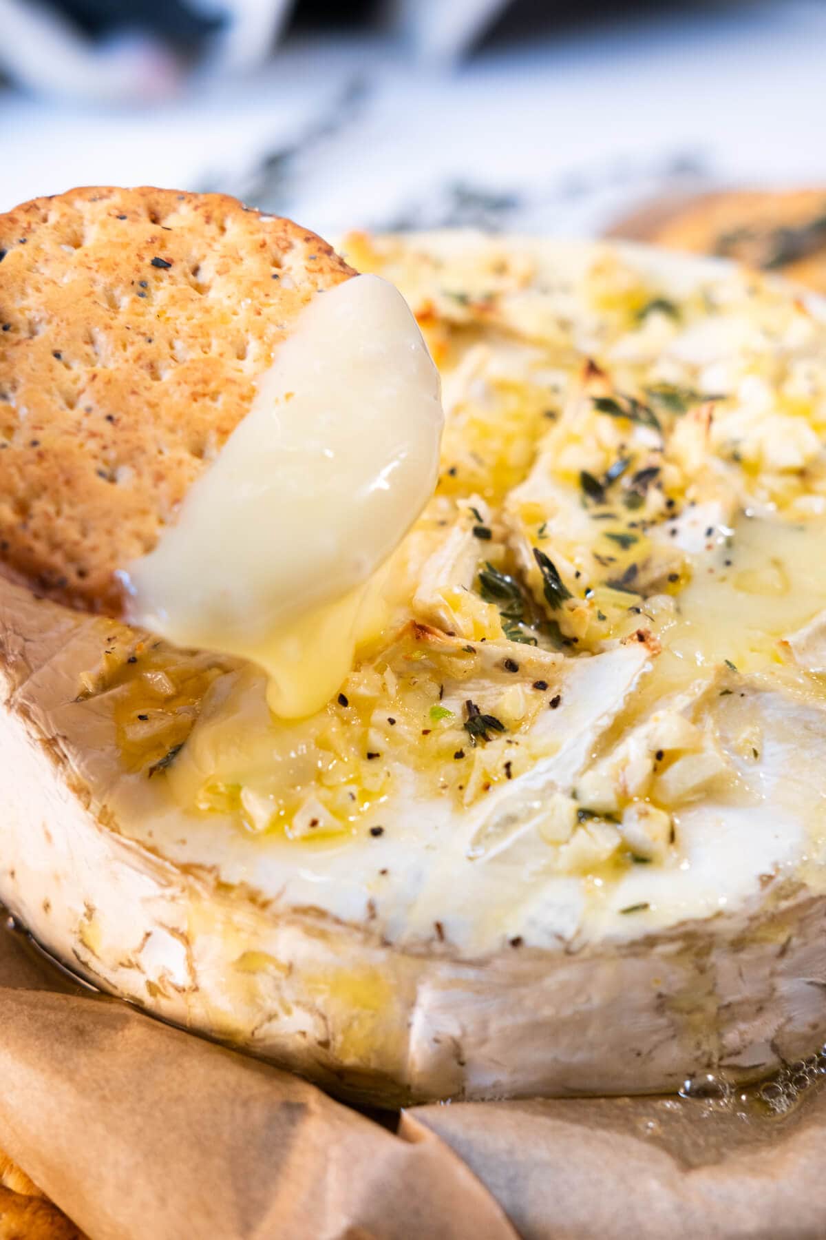 Crackers dip with garlicky, cheesy, and buttery baked brie. 